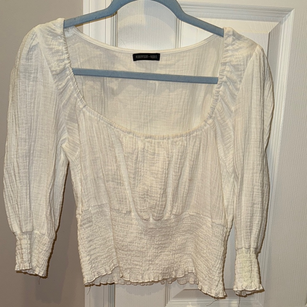 White smocked blouse with square neck and puff sleeves